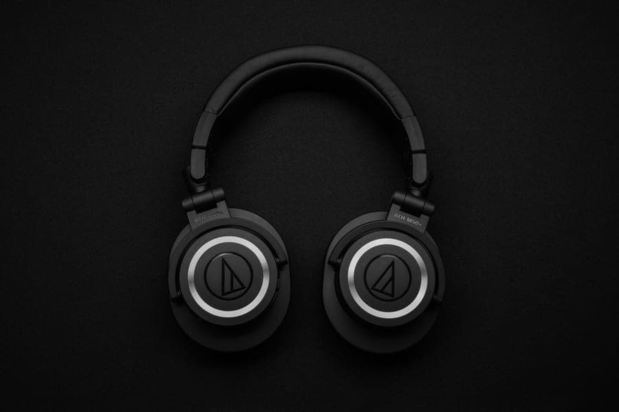 Black over-ear noise canceling headphones on a neutral background